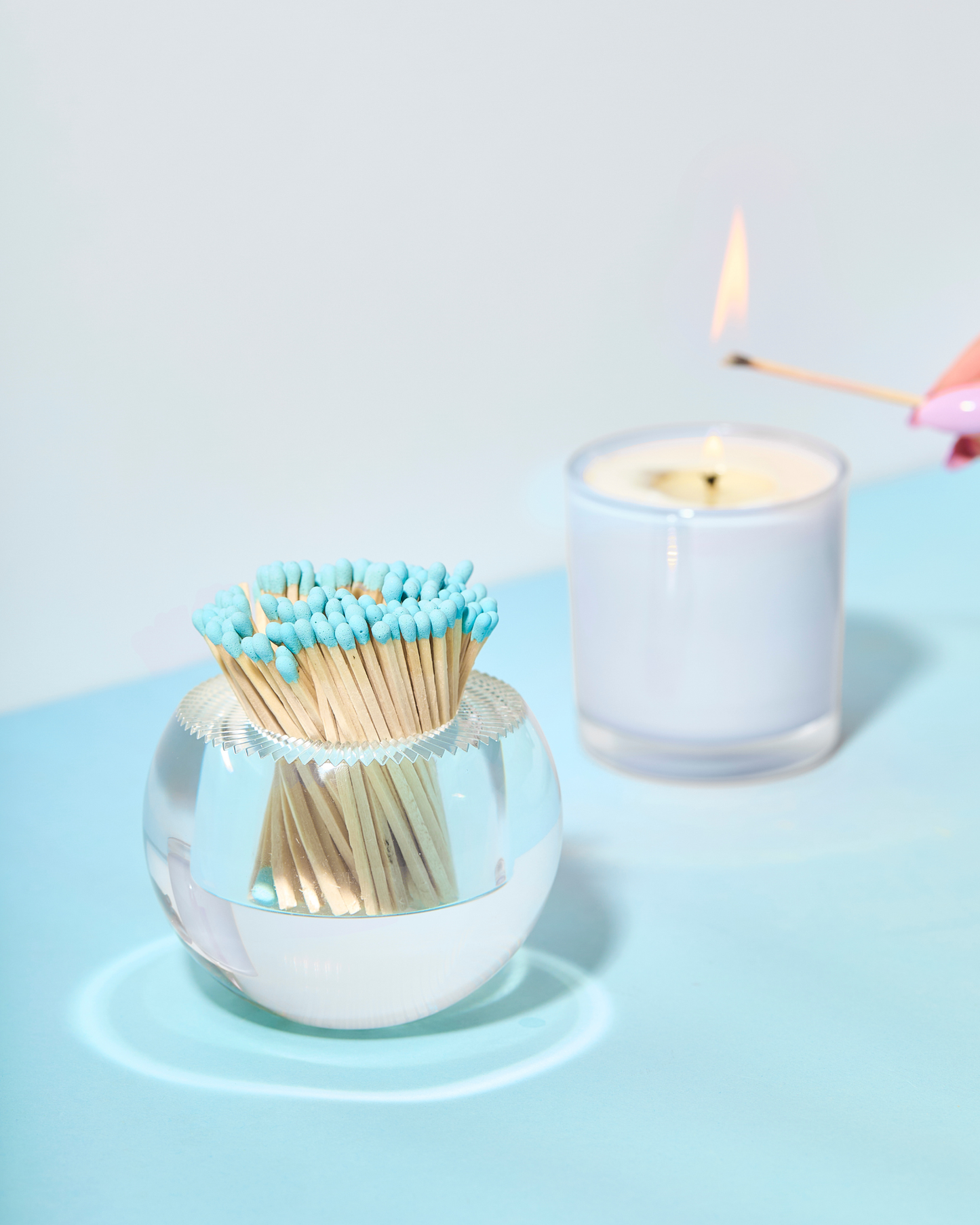 Light Blue Matches in Round Glass Container